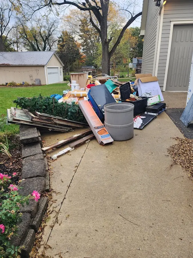 Dumpster being loaded with debris for Demolition Dumpster Rental in Spring Valley